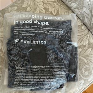 Fabletics Black and Gray Boost High waisted Leggings 7/8 length. New in package